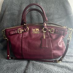 Coach Madison Satchel In Bordeaux, Hang Tag Has Been Monogrammed With Snowflakes, Handles Slightly Darker From Use, Has A Longer Shoulder Strap Coach Satchel With Gold-tone Hardware For Errands, Coach Burgundy Satchel For Travel, Burgundy Bags With Branded Hardware For Everyday, Coach Burgundy Tote Satchel, Coach Burgundy Bag With Detachable Handle, Coach Burgundy Satchel Bag, Burgundy Coach Bag With Detachable Handle, Burgundy Crossbody Satchel With Handles, Bags Coach