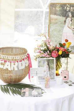 a table with flowers and pictures on it