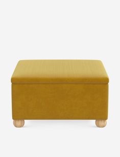 a yellow footstool with wooden legs and an upholstered cushion on top