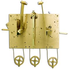 a golden clock with wheels attached to it