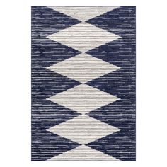 a blue and white rug with an abstract design on the bottom, in front of a white background