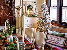 a dining room table decorated with christmas decorations