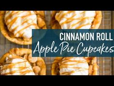 cinnamon roll apple pie cupcakes on a cooling rack with the words cinnamon roll apple pie cupcakes