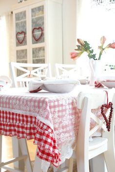 the table is set for valentine's day with red and white gingham