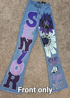 Custom made to order senior/hoco jeans. Walk in style showing your school spirit! I don't have finished jeans as this is a made to order item. See below for more info! JEANS WOULD NEED TO BE SHIPPED TO IN ORDER TO DO IT. Seniors Painted Jeans, Jean Pants Design, Senior Pants High Schools 2025, Purple Senior Jeans, Homecoming Jeans Ideas Sophomore, Senior Overalls Ideas High Schools 2025, Hoco Pants Ideas Sophomore, Senior Pants 2025, Hoco Jeans Painted Ideas