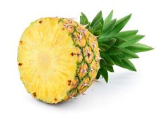 a pineapple cut in half on a white background