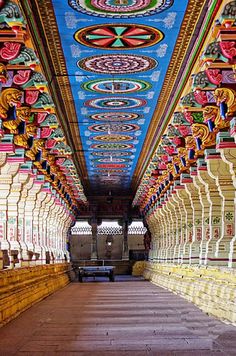 the inside of a building with many colorful decorations on it's walls and ceiling