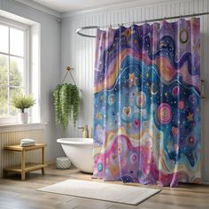 a bathroom with a bathtub, rug and shower curtain in the shape of an abstract painting