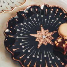 a plate that has some kind of dessert on it with a star decoration in the middle