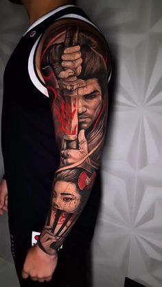 a man with a tattoo on his arm holding a knife