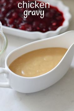 a white gravy dish with cranberry sauce in it and the words chicken gravy above it