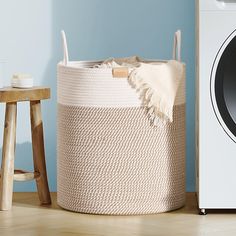 a laundry basket next to a washing machine