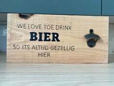 a wooden sign that says, we love to drink bier so it's aloud geezling her