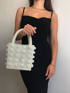 Bead bags are 100% handmade. The interior of the bag is quite large. It can fit most items, from phone to notebook. The bag will come with a special pouch. * Dimensions - Width: 17 cm - Height: 18 cm  - Depth: 10.5 cm About Bag; Apart from pearls, different beads and colors were used. Brides can use it as a handbag. * Materials - Luxury Plated Pearl * Shipping - Ships worldwide from İstanbul, Turkey. - Production time before shipment is 2-7 working days. - 2-5 business days is for USA shipment. White Clutch Box Bag With Top Carry Handle, White Rectangular Evening Bag With Top Carry Handle, Pearl White Bag With Pearl Handle, Pearl White Bag With Pearl Handle Rectangular, Pearl White Rectangular Bag With Pearl Handle, White Rectangular Bag With Pearl Handle, Rectangular Pearl White Shoulder Bag, Pearl White Handmade Rectangular Evening Bag, White Top Handle Bag For Events