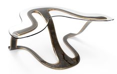 a glass and metal coffee table with curves on it's sides, against a white background