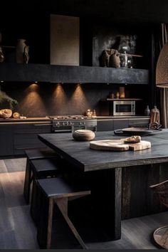 a kitchen with black walls and wooden floors