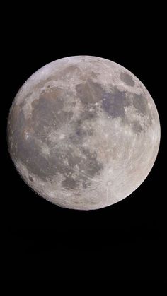 the full moon is shown in the dark sky