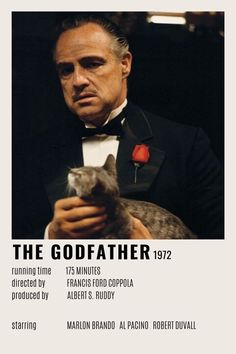 a man in a tuxedo holding a cat with the caption'the godfather 1932 '