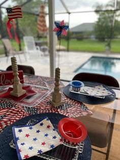 a patriotic table setting with plates and napkins