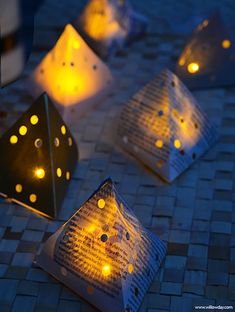 paper lanterns are lit up on the ground