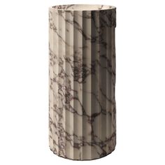 a white vase with brown and black marble pattern on it's sides, in front of a white background