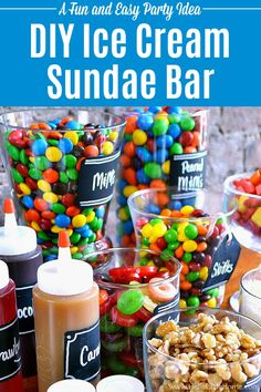 an ice cream sundae bar with lots of candy and candies on the table