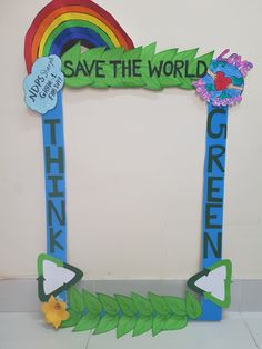 a photo frame made out of paper with the words save the world and green on it