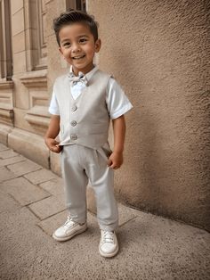 ✿ABOUT THIS SUİT ✓This luxurious four-piece beige suit set creates a stylish and personalized look for your little one's special day. ✓The set includes silk alpaca suspender pants, a vest, a bow tie, and a cotton short-sleeve shirt.  ✓The pants have an elastic waistband for a comfortable fit and adjustable straps for the perfect fit. Made of soft and comfortable silk alpaca fabric, the pants and vest are beige.  ✿FABRIC INFORMATION ✓Cotton, silk alpaca. ✓ The color of your item may vary slightly Fitted Beige Sets For Baptism, Classic Cream Baptism Clothing Set, Elegant Beige Sets For Baptism, Classic Cream Sets For Baptism, Elegant Beige Baptism Set, Elegant Cream Sets For First Communion, Elegant Cream First Communion Sets, Alpaca Fabric