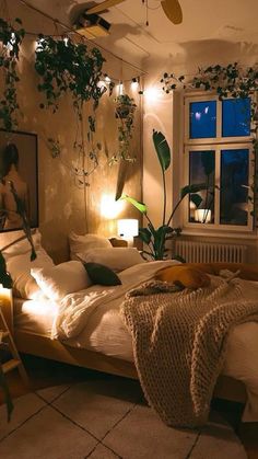 a bedroom with plants on the wall and lights in the ceiling, along with a bed