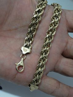 The bracelet is crafted from 14k yellow gold and features a rope design, measuring 7.5 inches in length and 7mm wide, with a weight of 10 grams. Gold Rope Chain Bracelet, Design Bracelet, Rope Design, Chain Link Bracelet, Houston Tx, Bracelet Designs, Link Bracelets, Arm Band, Chain Link