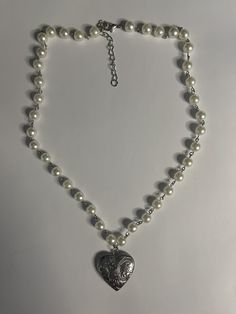 Necklace - pearl beads with heart locket 11-12 inches long with adjustable length Pearl Locket Necklace, Beaded Locket Necklace, Wire Pearl Necklace, White Beaded Heart-shaped Pearl Necklace, Silver Pearl Heart Necklace With Pearl Charm, Heart-shaped Pearl Beaded Necklace For Valentine's Day, Valentine's Day Heart-shaped Pearl Beaded Necklace, Adjustable Heart-shaped Pearl Necklace, Valentine's Day Pearl Beaded Necklaces With Heart Beads