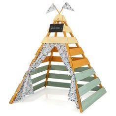 a wooden teepee with flowers on it and a sign that says welcome to the family