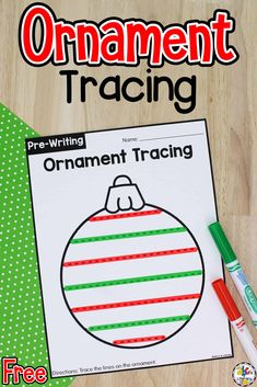 an ornament tracer for christmas is shown on a table with markers and pens