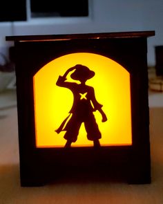 Black colored Luffy lantern from anime one piece manga emitting  red and orange beautiful lighting. Luffy Pumpkin Carving, Marvel Iphone Wallpaper, Anime Diys, Wood Carving Art Sculpture, Laser Cut Decor, Cricut Explore Projects, Lantern Ideas, Woodworking Shop Projects, Neon Decor