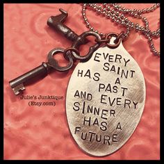 a key chain with a quote on it that says every saint has a past and every sinner has a future