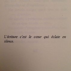 an open book with writing in french on the page and another type of text below it