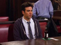 a man sitting at a table in a restaurant