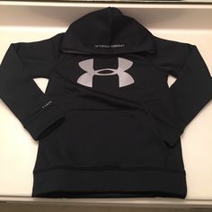 The Under Armour Boy's Armour Fleece Big Logo Hoody Is Ua's Original Performance Replacement For Old-School Sweatshirts: Unbelievably Light, But Somehow Keeps You Really Warm. If That Wasn't Enough, Its Stretchy, Breathable & Features Ua Storm To Keep Off The Rain & Snow.Front Kangaroo Pocket.Fit: Fuller Cut For Complete Comfort.Import. Black Hoodie With Fleece Lining For Outdoor Activities, Black Fleece Outdoor Tops, Black Fleece Tops For Outdoor, Under Armour Black Outdoor Tops, Black Fleece-lined Sweatshirt For Outdoor Activities, Black Tops With Drawstring Hood For Outdoor Activities, School Sweatshirts, Under Armour Shirts, The Rain