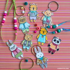 several key chains with cartoon animals on them and beaded necklaces attached to them