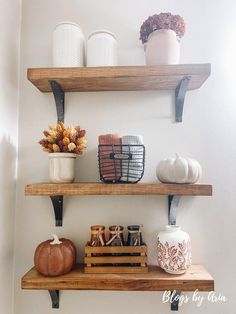 three wooden shelves with decorative items on them