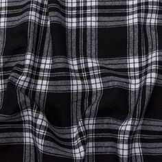 Keep your designs stunningly neutral with this Black and White Plaid Cotton Flannel. White stripes form a surprisingly intricate plaid pattern over a black background for a delightfully monochrome look. Super soft, with a fuzzy brushed finish on the face, the malleable, supple drape is ideal for button-downs, loose blazers, or circle skirts. Opaque, a lining may be desired for some tailored applications but isn't necessary for most projects. Grunge Moodboard, Grunge Flannel, Printed Linen Fabric, Circle Skirts, Wool Quilts, Tencel Fabric, Mood Fabrics, Silk Tulle, Black And White Plaid