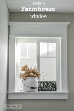 a window with a sign that says make a farmhouse window above it and a potted plant in the window sill