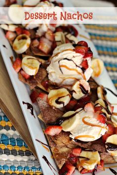 dessert nachos with strawberries, bananas and chocolate drizzled on top