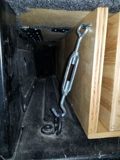 the back end of a truck with a chain attached to it's cargo compartment