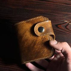 Discover the exquisite craftsmanship of our handcrafted wallet, made from the finest Shell Cordovan leather in a stunning marbled brown finish. This premium wallet combines timeless elegance with practical functionality, perfect for those who appreciate the finer things in life. Features: Material: Shell Cordovan Leather, known for its exceptional durability and unique patina over time. Color: Marbled Brown, offering a distinctive and sophisticated look. Dimensions: 10 x 11 cm (3.94 x 4.33 inche Handmade Brown Wallet For Formal Occasions, Classic Handmade Wallets For Formal Occasion, Brown Waxed Finish Wallets As Gifts, Luxury Brown Trifold Wallet As Gift, Luxury Handmade Wallets For Everyday Use, Luxury Handmade Wallets, Handmade Classic Leather Wallet, Classic Handmade Leather Wallet, Handmade Brown Wallet For Everyday Carry