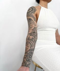 a woman with a tattoo on her arm