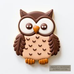 an owl cookie sitting on top of a white table