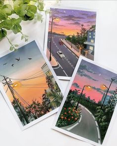 three postcards with an image of a street at sunset