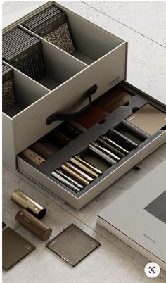 an open drawer with various items in it