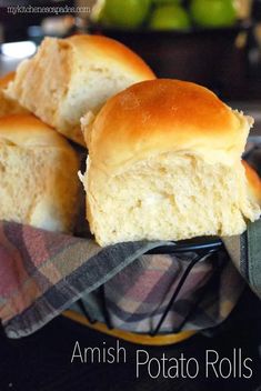 some rolls are sitting in a bowl on a table